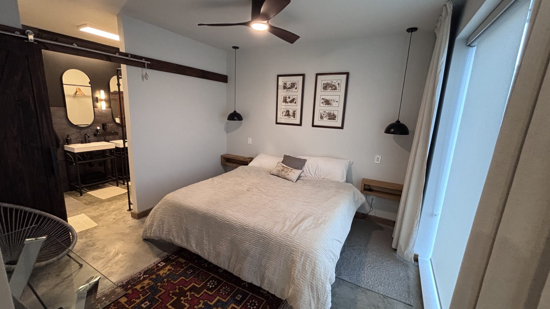 Second bedroom with a sliding barn door to the ensuite