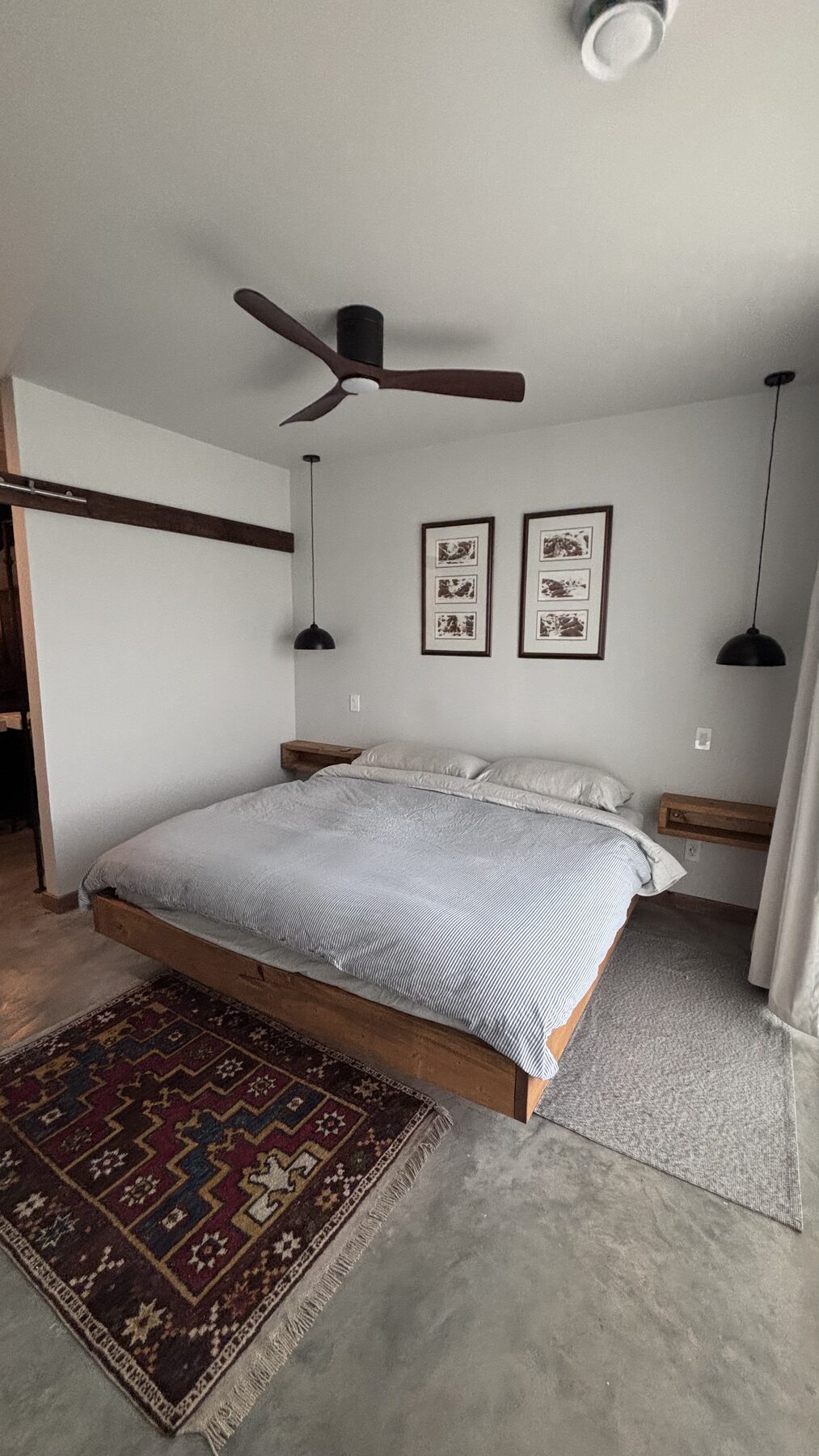 Primary bedroom with a floating platform bed